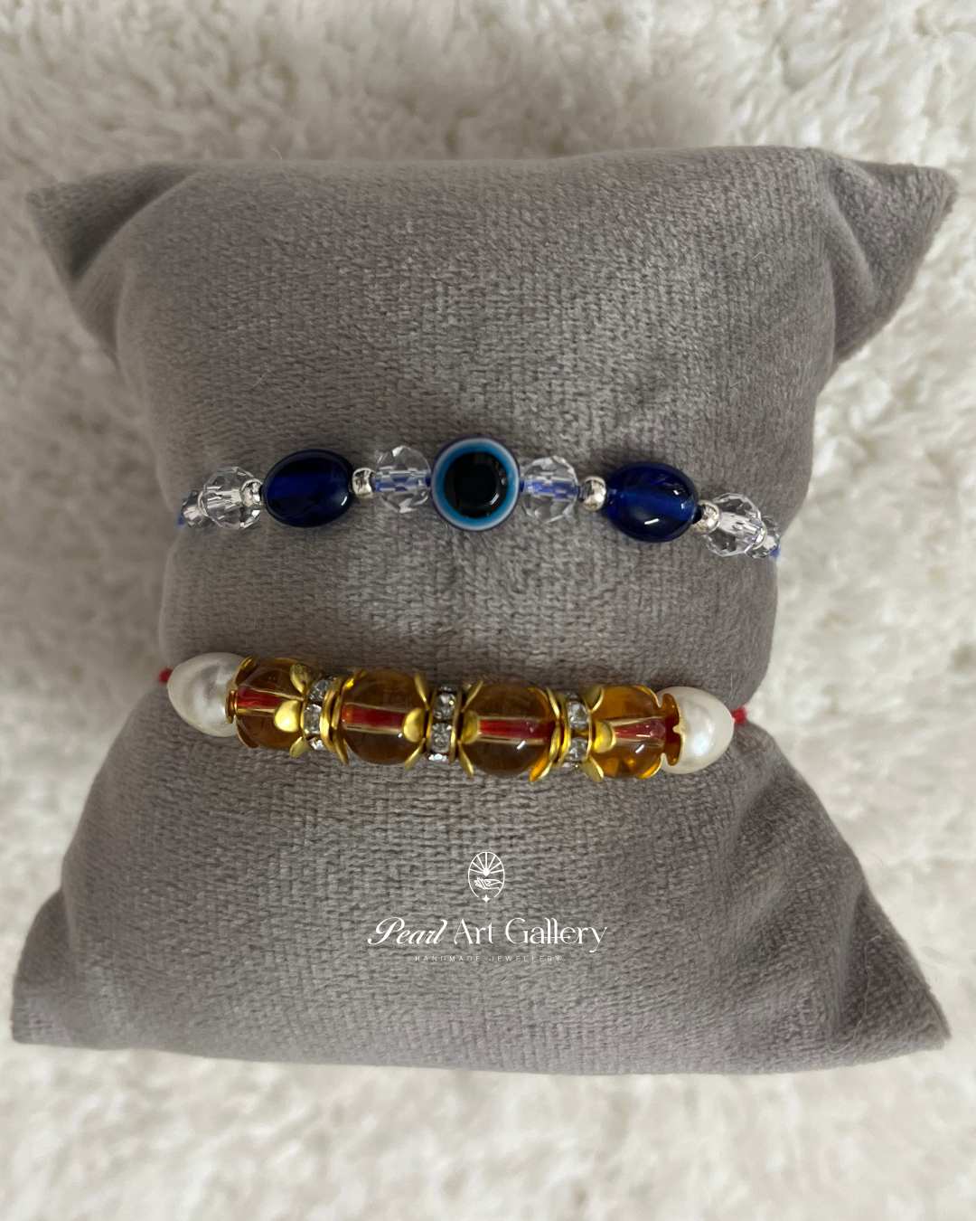 Festive Duo Rakhi Set – Evil Eye & Traditional Crystal