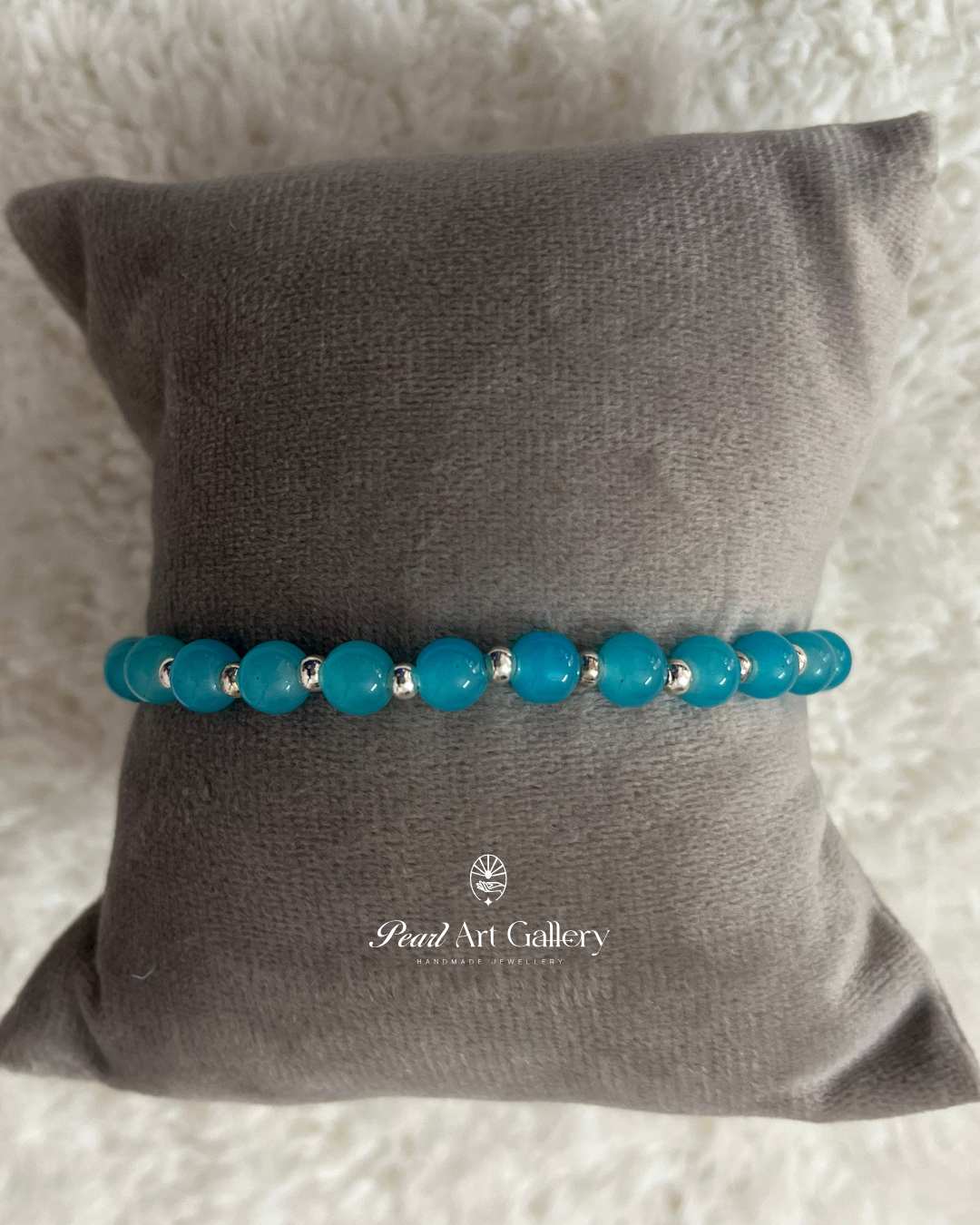 Turquoise Blue Bead Chain Rakhi with Silver Highlights