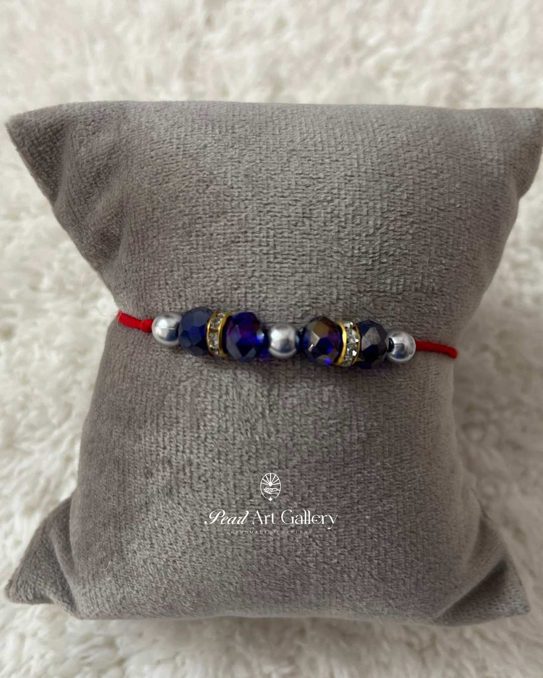 Royal Blue Bead Rakhi with Silver Accents