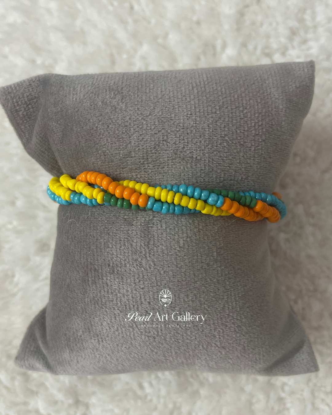 Vibrant Twist Bead Rakhi – Multicolour Chain Style