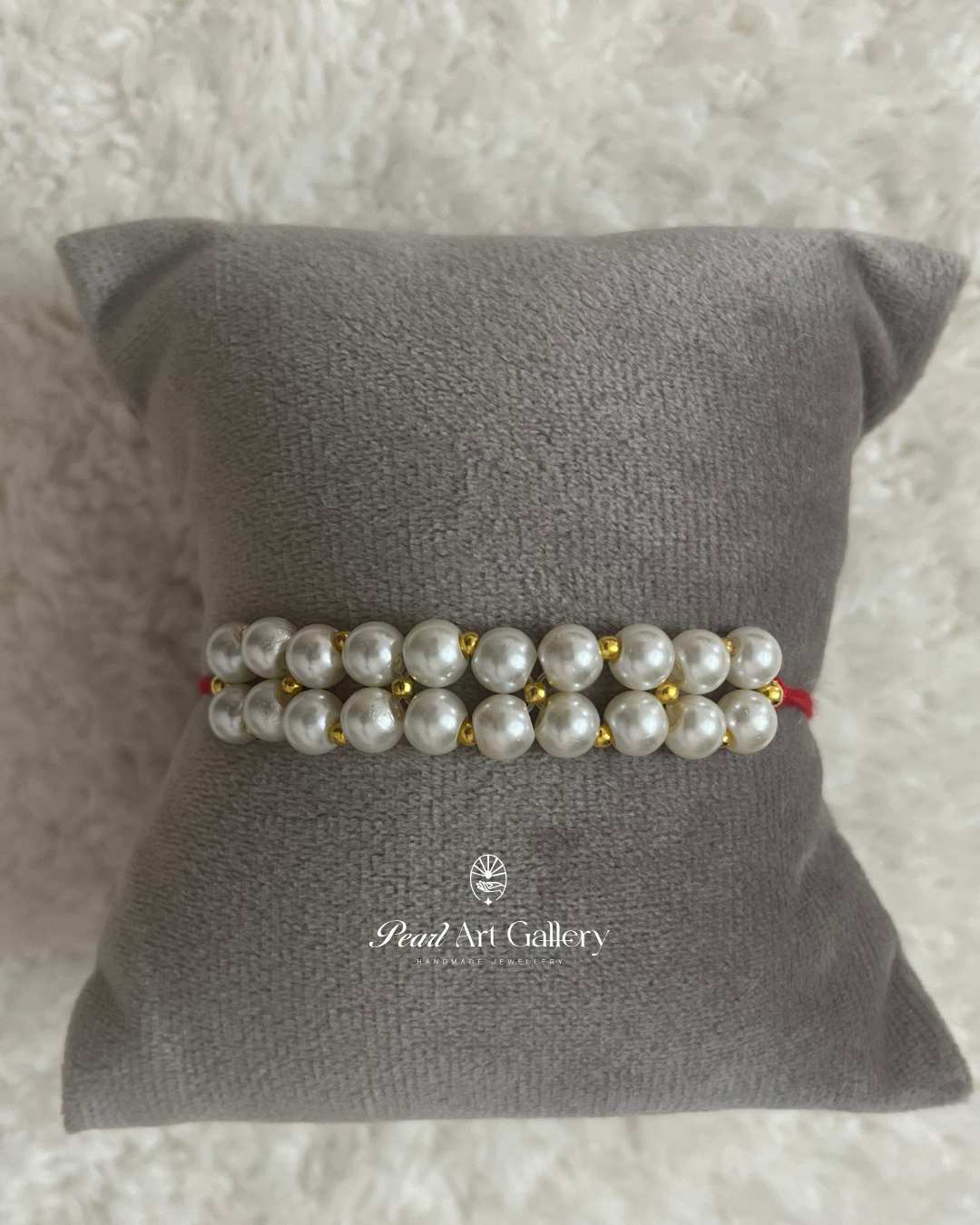 Double-Row White Pearl Rakhi – Thread Style with Gold Details