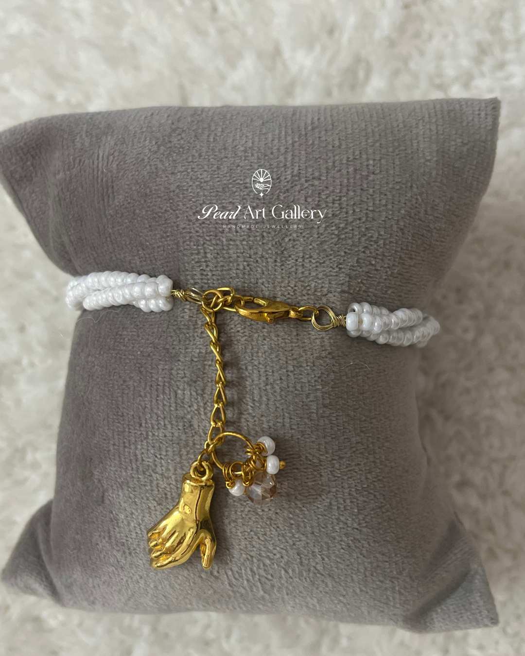 Divine Grace Beaded Rakhi – White Twist Chain with Hand Charm