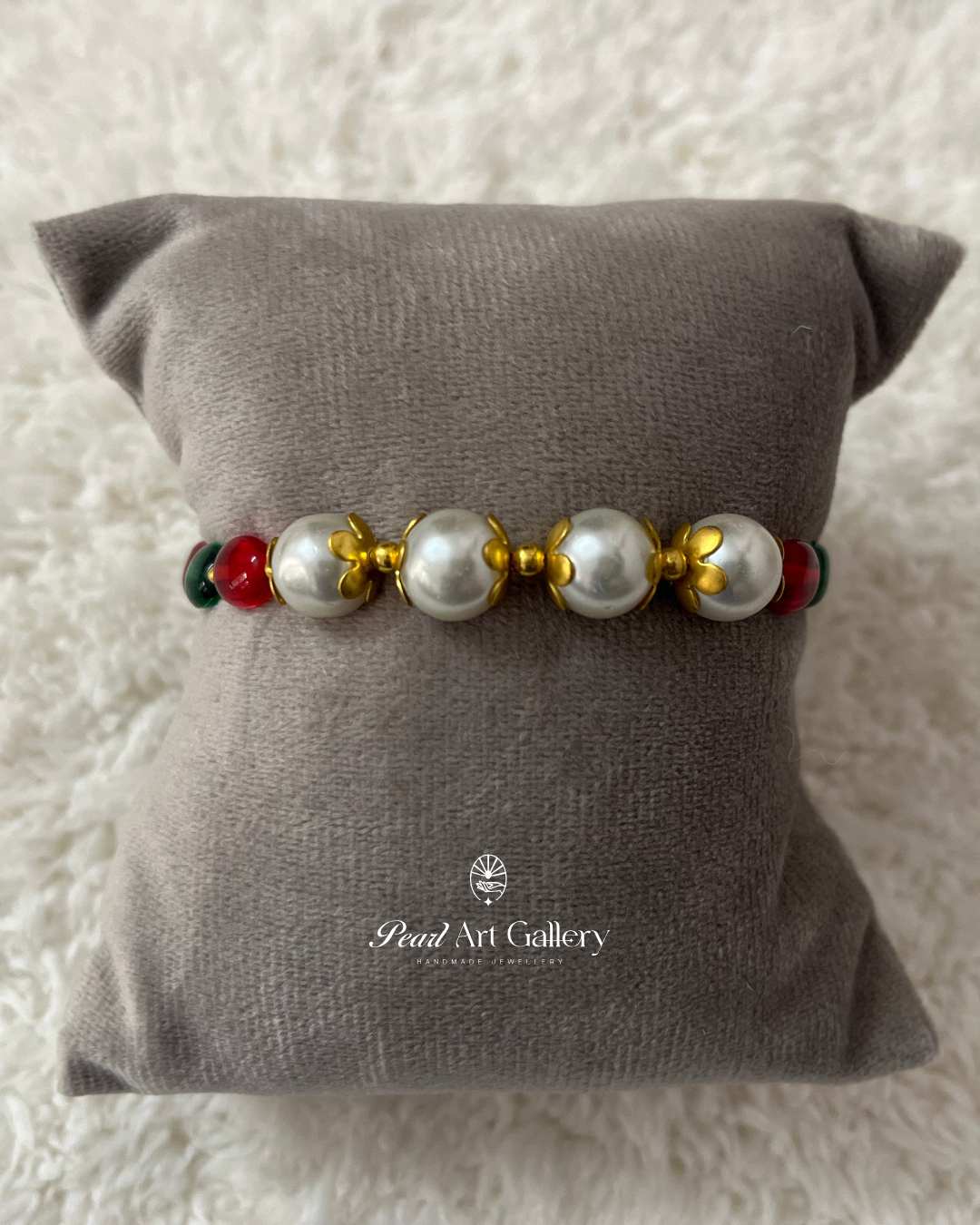 Classic Pearl Rakhi with Red & Green Beads