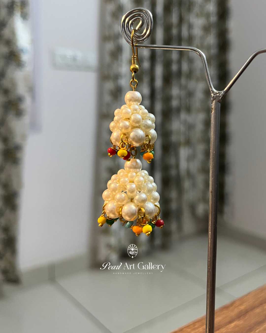 Glass Pearl Off-White Jhumka with Multicoloured Tassels - Pearl Art Gallery