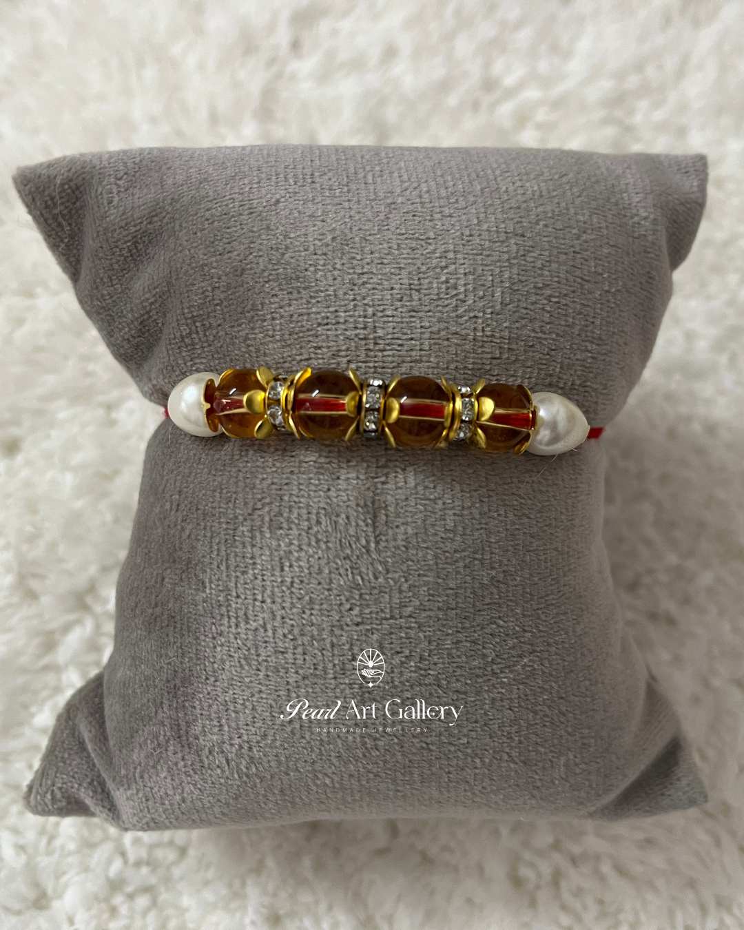 Traditional Crystal Bead Rakhi with Red Thread - Pearl Art Gallery